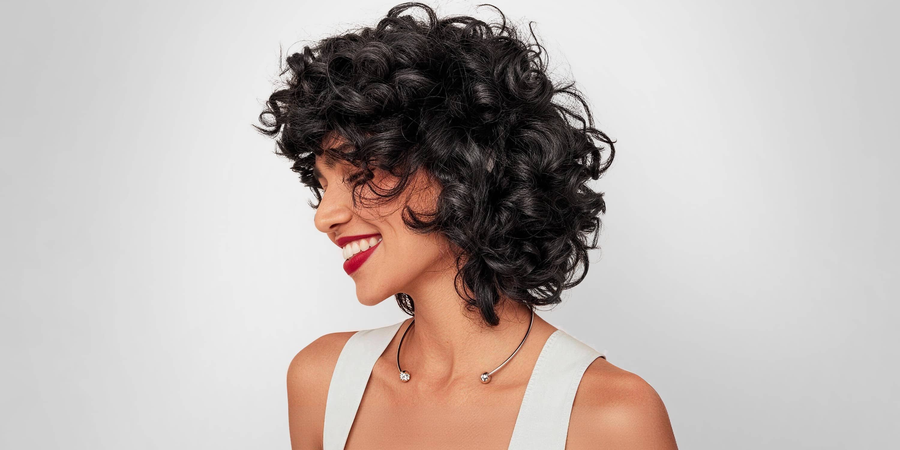 After image showing glossy natural black curly hair results after using Limer hair dye shampoo for gray coverage comparison